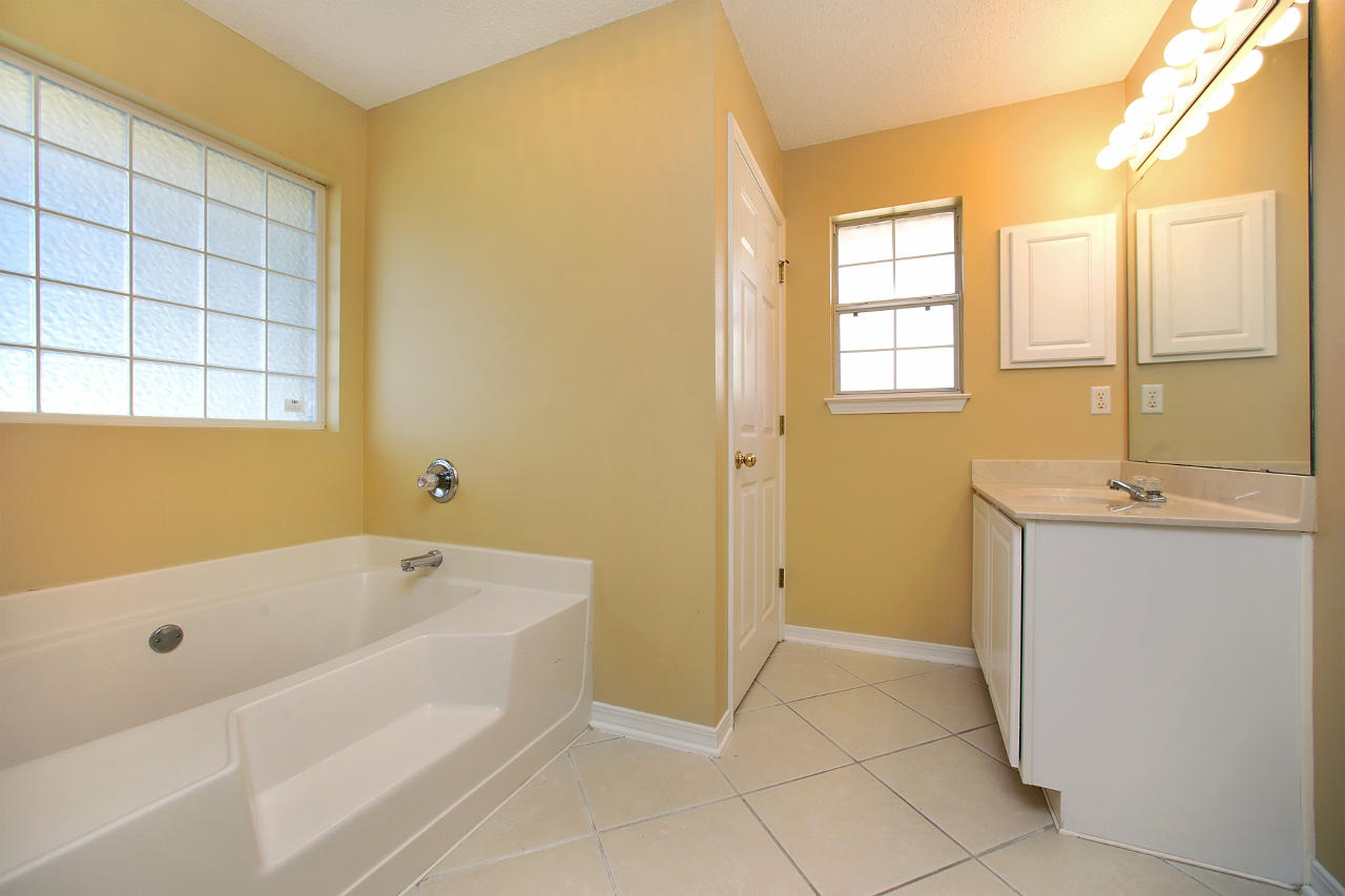 27 Inlet Drive Miramar Beach, FL 32550 - Photo 13 of 23 a bathroom with a tub sink and a shower
