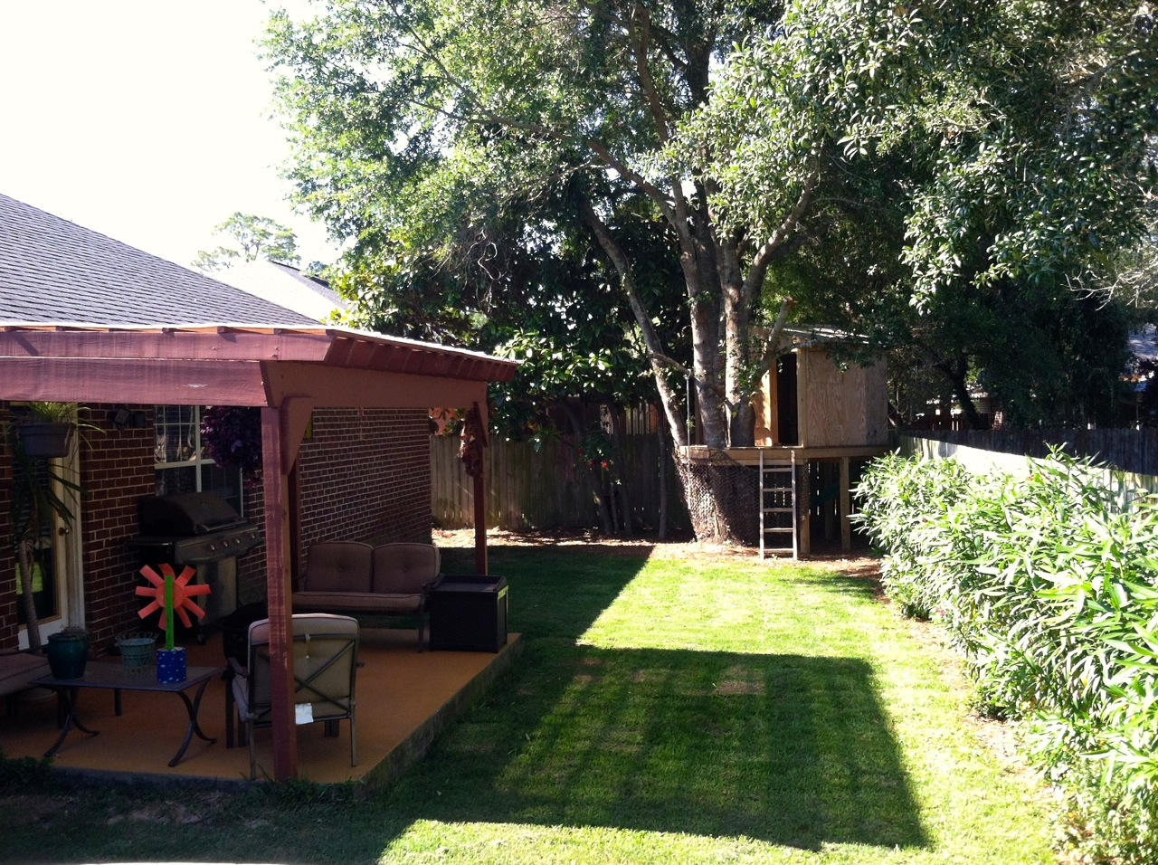 27 Inlet Drive Miramar Beach, FL 32550 - Photo 18 of 23 a view of a patio with table and chairs potted plants and large tree