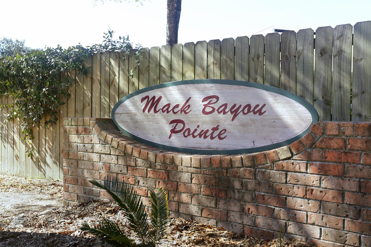 27 Inlet Drive Miramar Beach, FL 32550 - Photo 21 of 23 a sign on the side of a building
