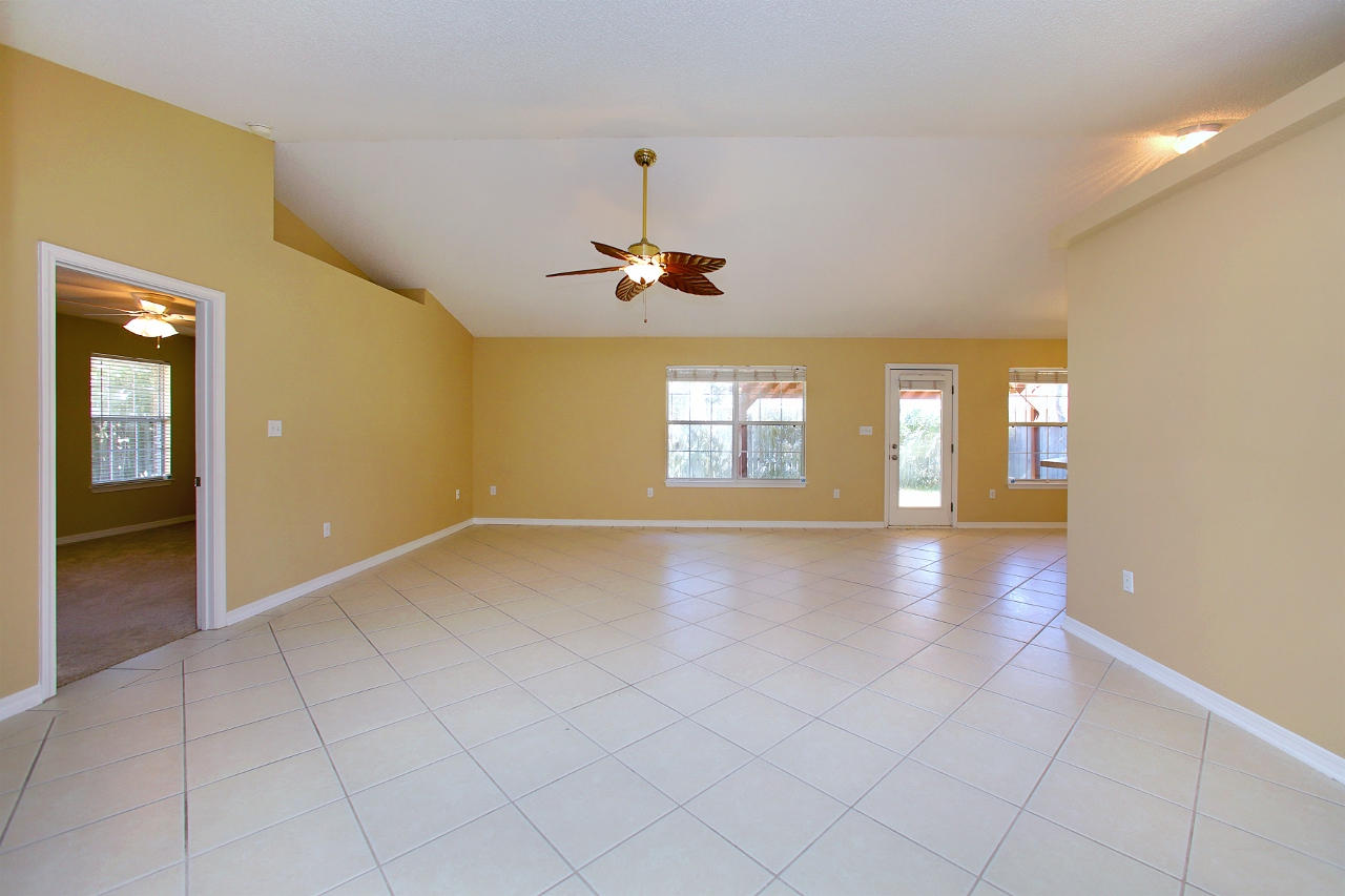 27 Inlet Drive Miramar Beach, FL 32550 - Photo 5 of 23 wooden floor in an empty room with a window