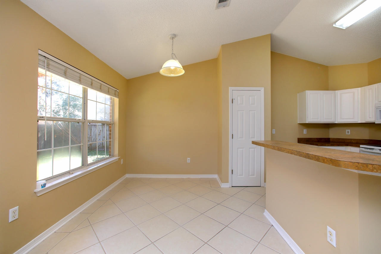 27 Inlet Drive Miramar Beach, FL 32550 - Photo 7 of 23 a view of a kitchen with wooden floor and a window