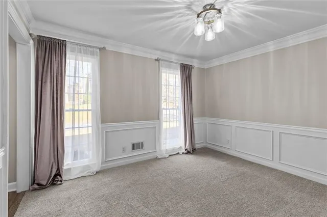 a kitchen with stainless steel appliances a refrigerator sink and cabinets