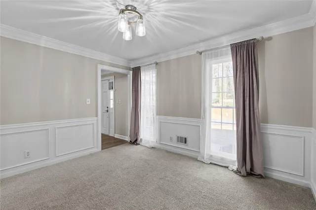 a kitchen with granite countertop a refrigerator and a stove