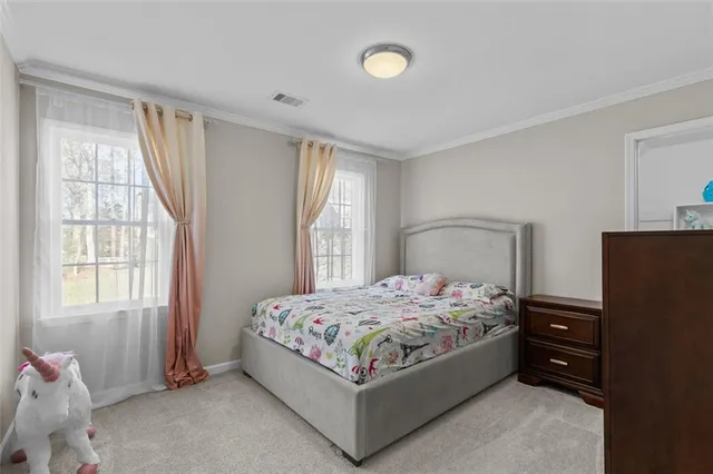 a living room with furniture and windows