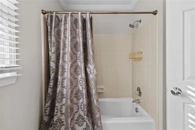 a view of a house with a wooden deck