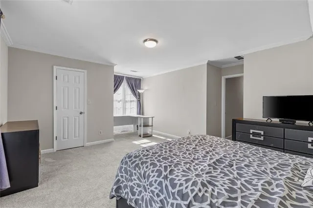 a view of a wooden deck with large trees and wooden fence