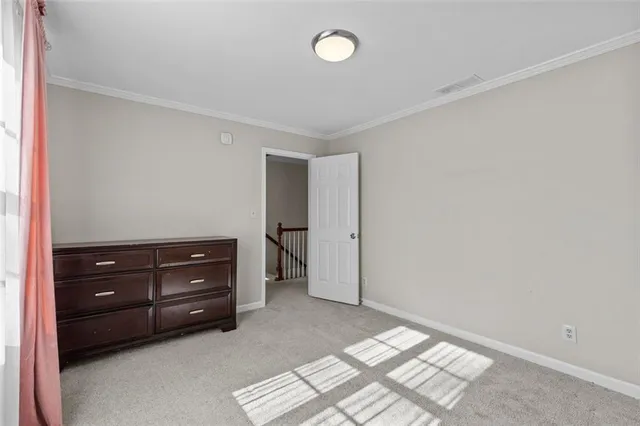 a view of a chair and table in the backyard