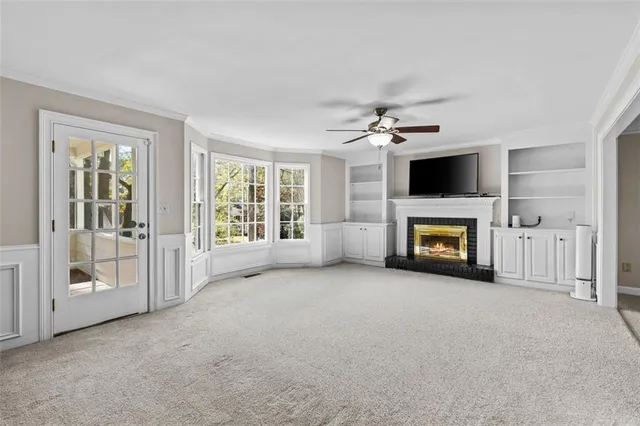 a big room with windows and closet