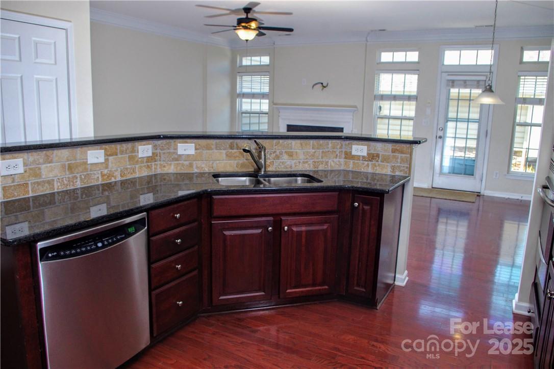 8339 Viewpoint Lane Cornelius, NC 28031 - Photo 13 of 30 a kitchen with granite countertop a sink and a stove