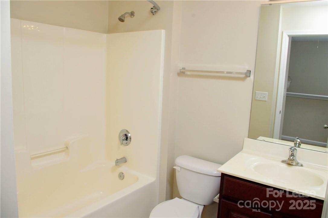 8339 Viewpoint Lane Cornelius, NC 28031 - Photo 24 of 30 a bathroom with a sink a toilet and shower