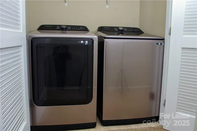 a utility room with dryer and washer