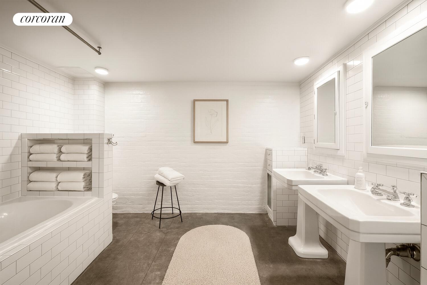 125 Watts Street, Unit 1 Manhattan, NY 10013 - Photo 12 of 18 a bathroom with a sink a bathtub and a window