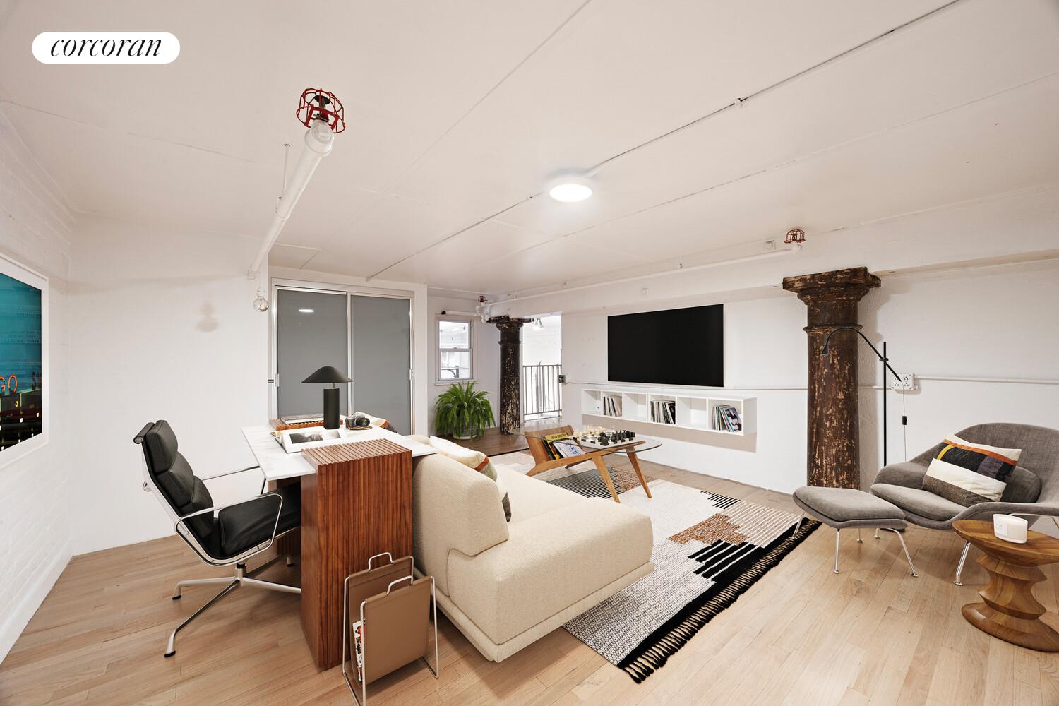 125 Watts Street, Unit 1 Manhattan, NY 10013 - Photo 13 of 18 a living room with furniture and a flat screen tv