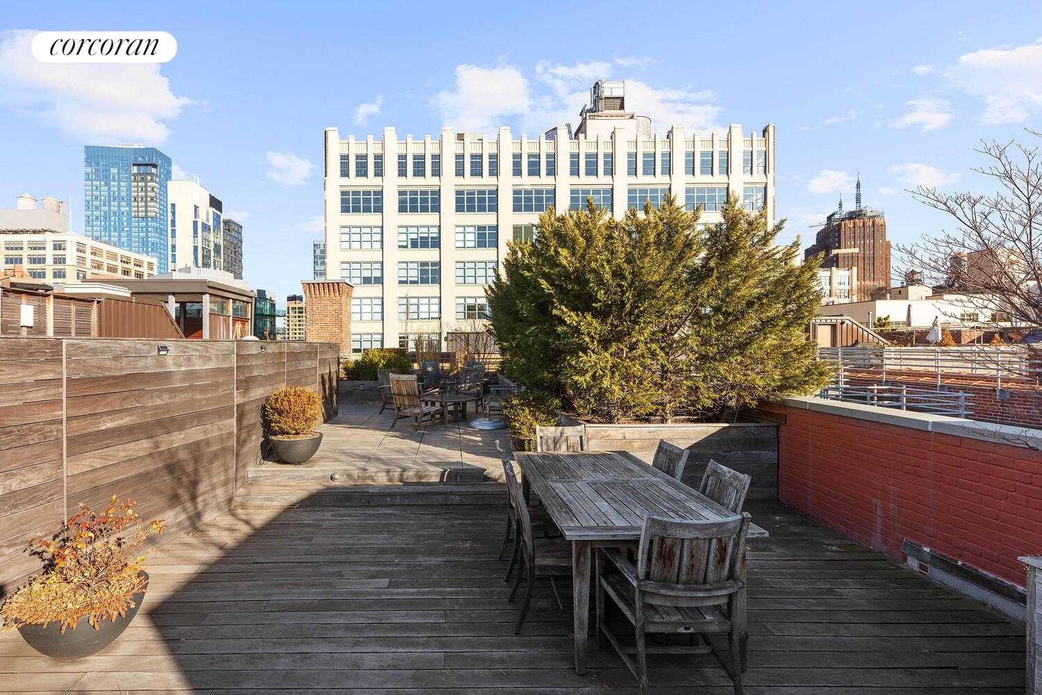 125 Watts Street, Unit 1 Manhattan, NY 10013 - Photo 16 of 18 a view of a chairs and table on the wooden deck