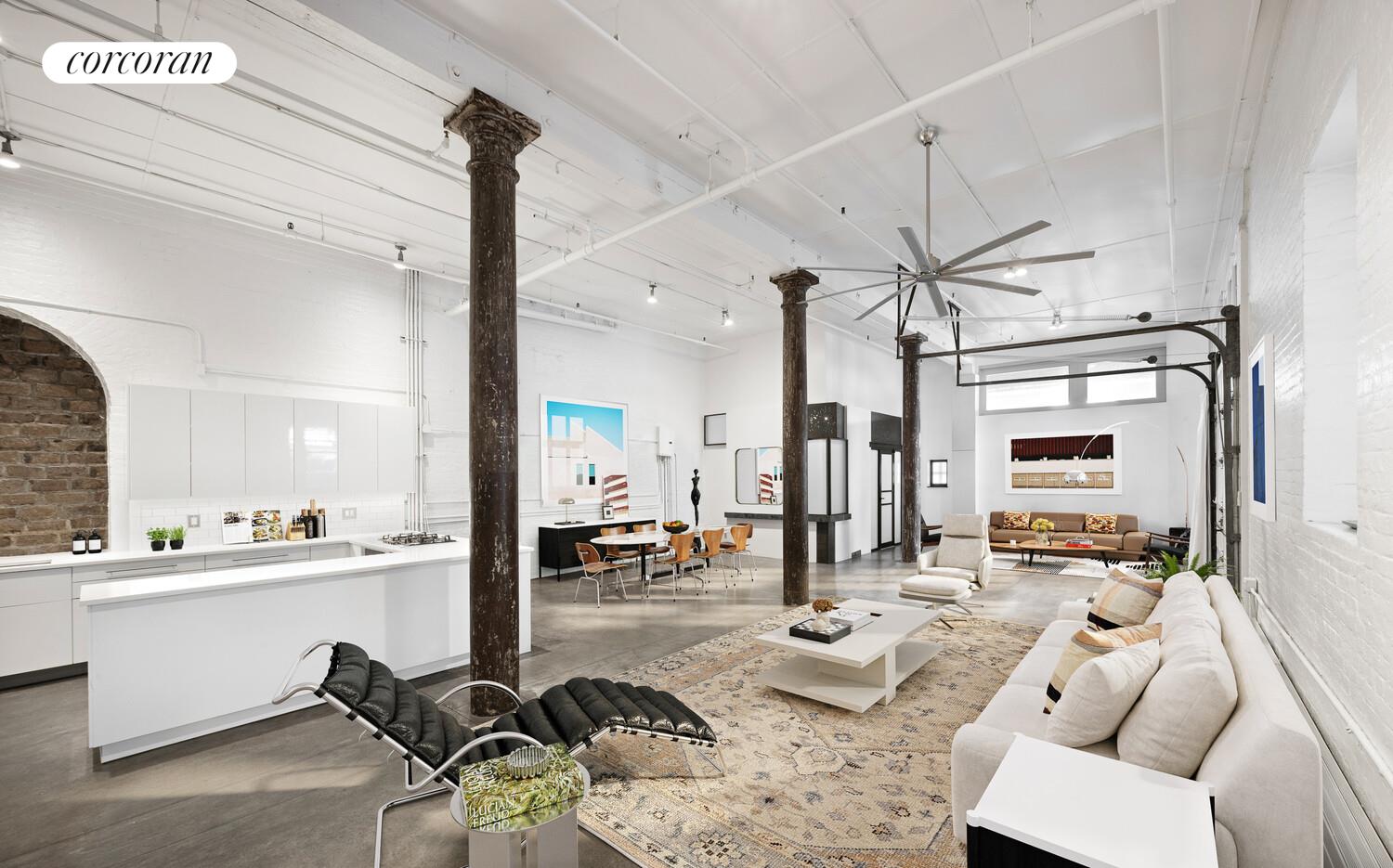 125 Watts Street, Unit 1 Manhattan, NY 10013 - Photo 5 of 18 a living room with furniture and a large window
