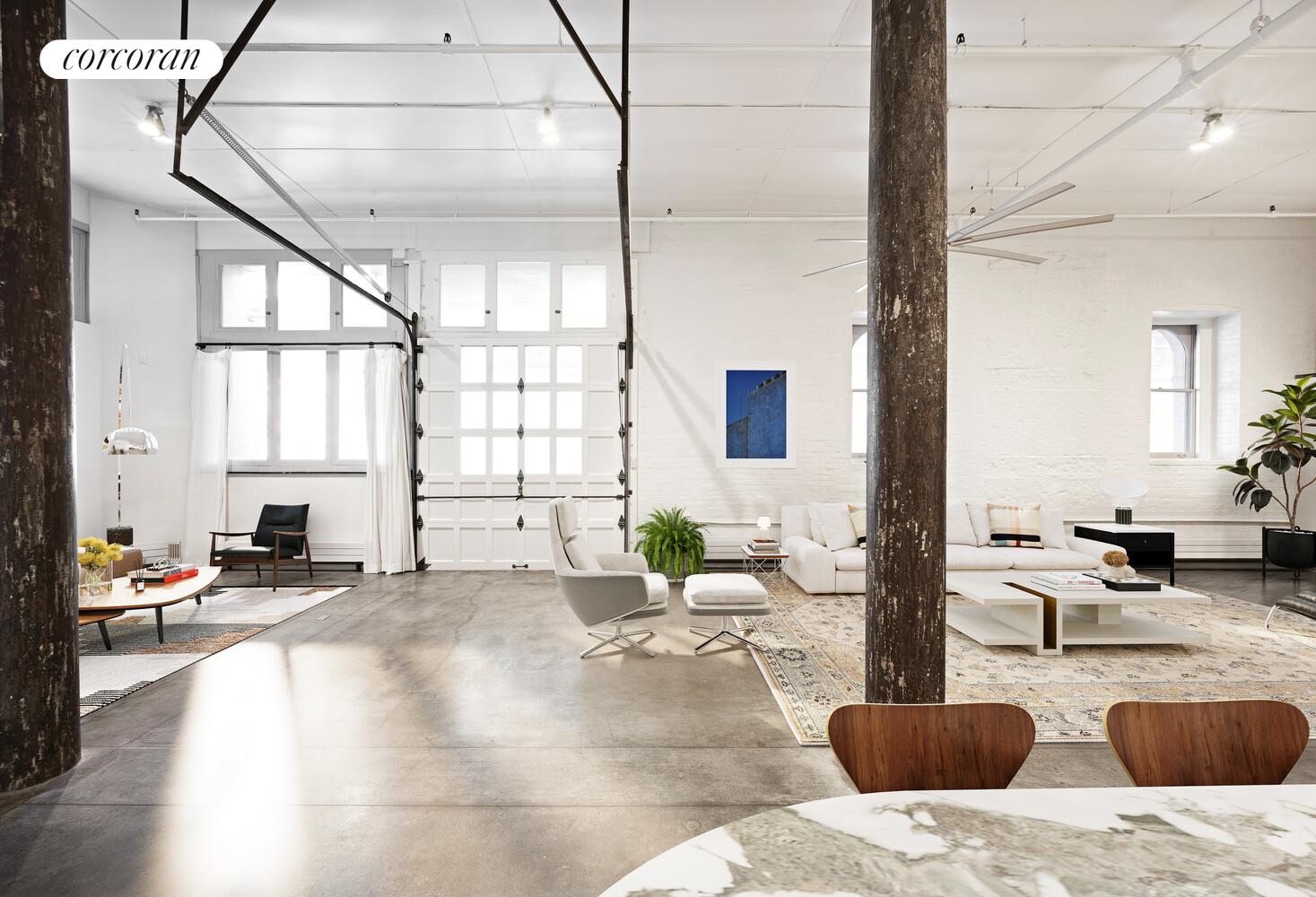 125 Watts Street, Unit 1 Manhattan, NY 10013 - Photo 8 of 18 a living room with furniture stove and a window