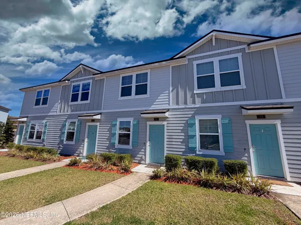 a front view of a house with a yard