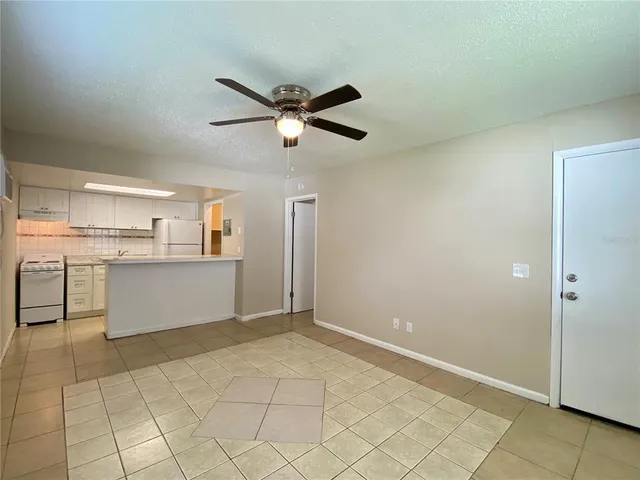 a view of a kitchen with a sink and dishwasher cabinet