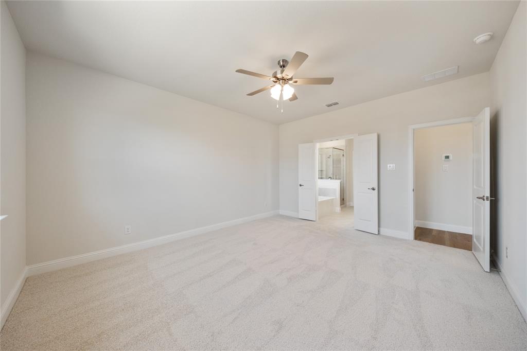 116 Old Glory Lane Forney, TX 75126 - Photo 18 of 23 a view of a big room with chandelier fan and closet area