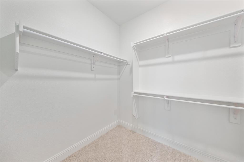 116 Old Glory Lane Forney, TX 75126 - Photo 19 of 23 a view of an empty walk in closet