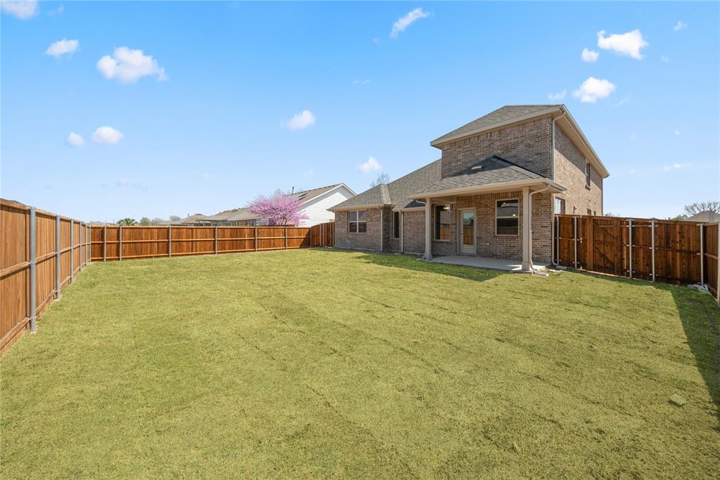 116 Old Glory Lane Forney, TX 75126 - Photo 2 of 23 a view of a house with a backyard