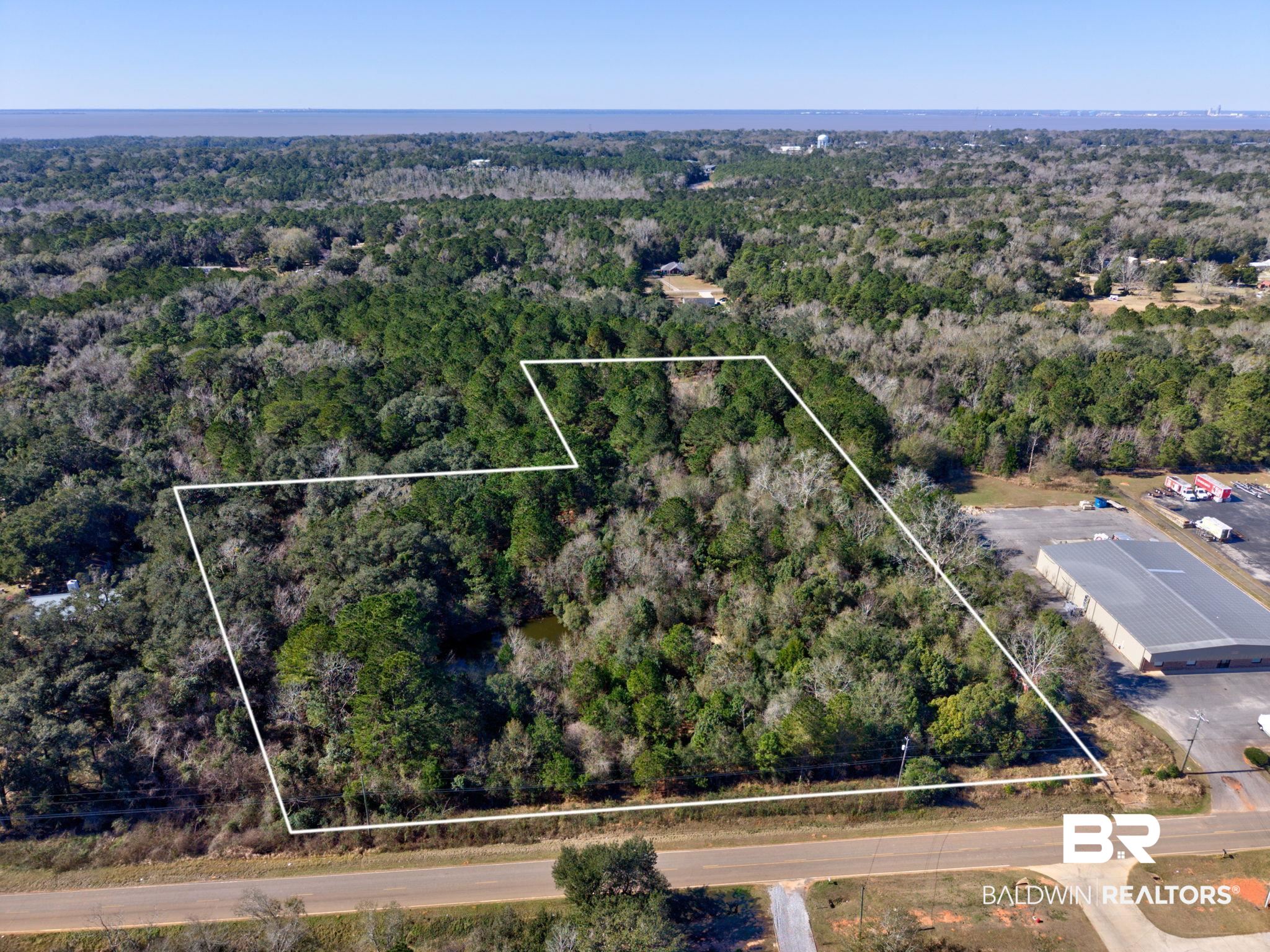 25280 Friendship Road Daphne, AL 36526 - Photo 12 of 34 Aerial view of property's location featuring property boundaries highlighted and a forest