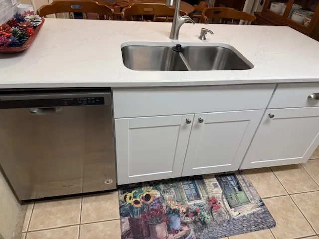 a bedroom with a bed and cabinets