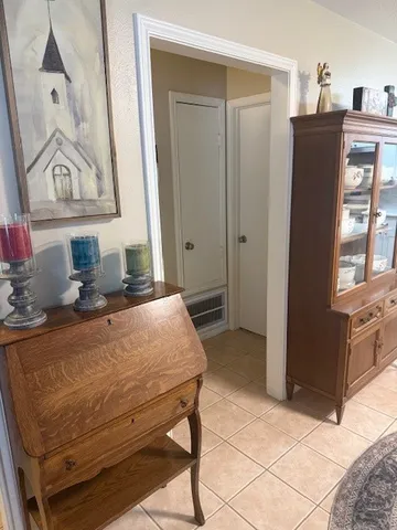 a living room with furniture a table and chairs