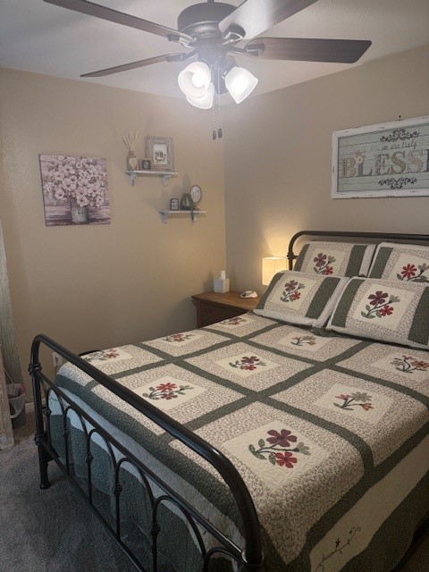 2402 Sycamore Avenue, Unit E3 Huntsville, TX 77340 - Photo 26 of 38 a bed sitting in a bedroom next to a lamp