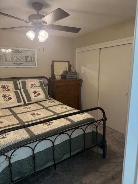 2402 Sycamore Avenue, Unit E3 Huntsville, TX 77340 - Photo 27 of 38 a bedroom with a bed and a chandelier