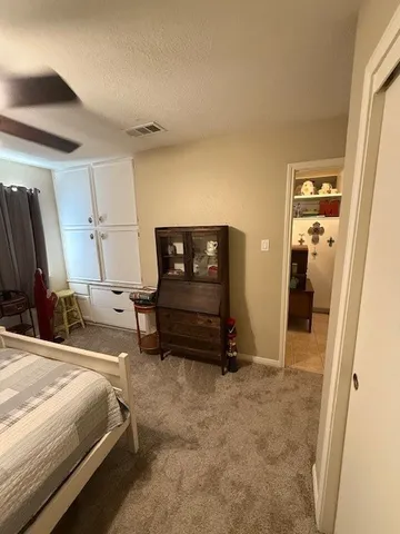 a bathroom with a toilet mirror and vanity
