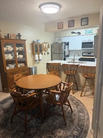 a view of a dining room with furniture