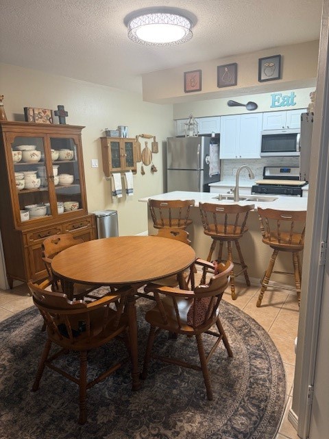 2402 Sycamore Avenue, Unit E3 Huntsville, TX 77340 - Photo 8 of 38 a dining room with a table and chairs