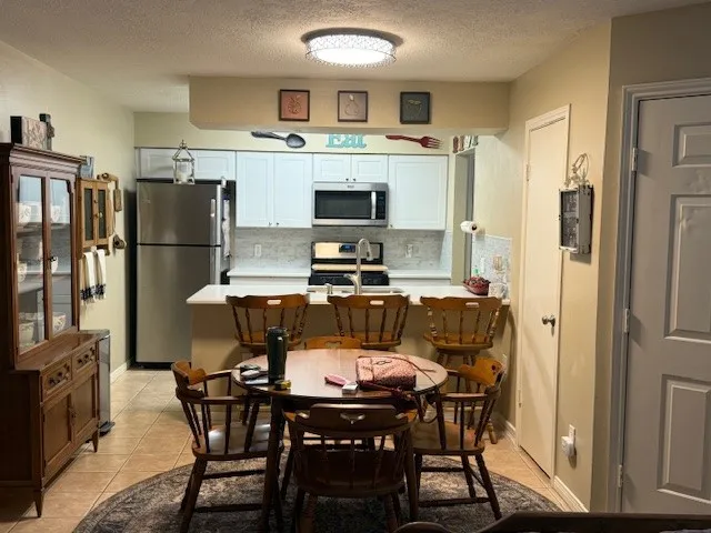 a room with a bed and furniture