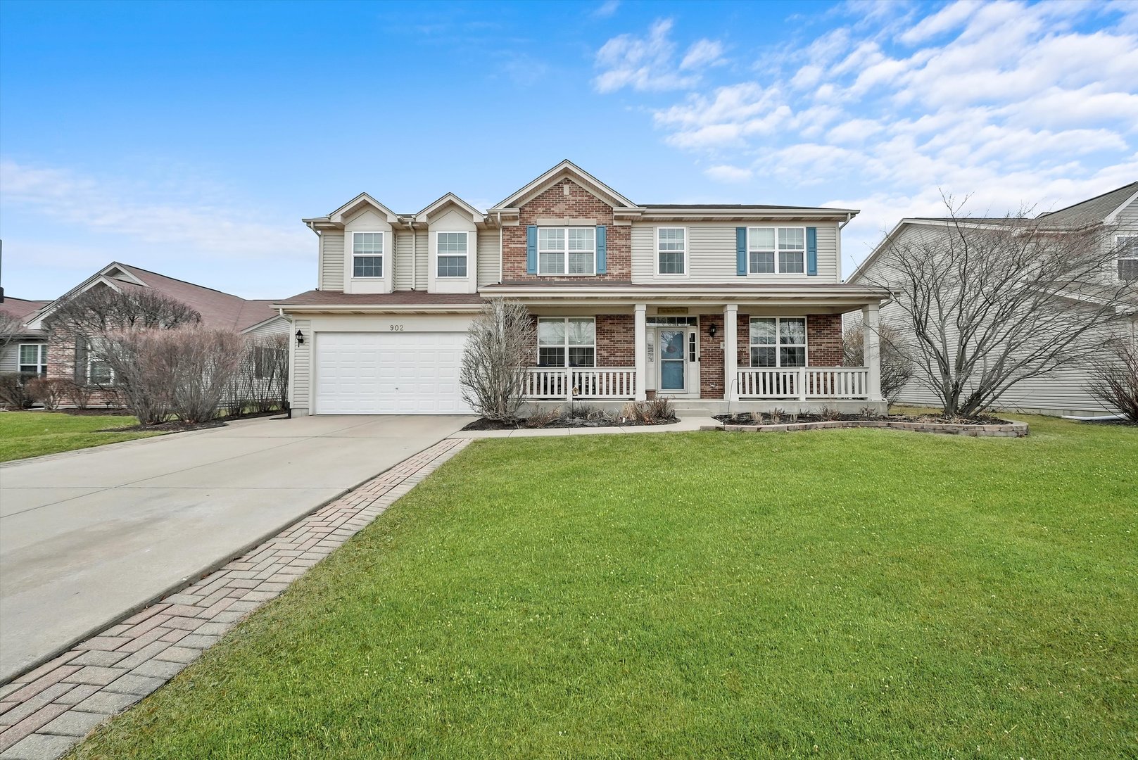 902 Farmstead Lane Shorewood, IL 60404 - Photo 1 of 35 a front view of a house with a garden and lake view