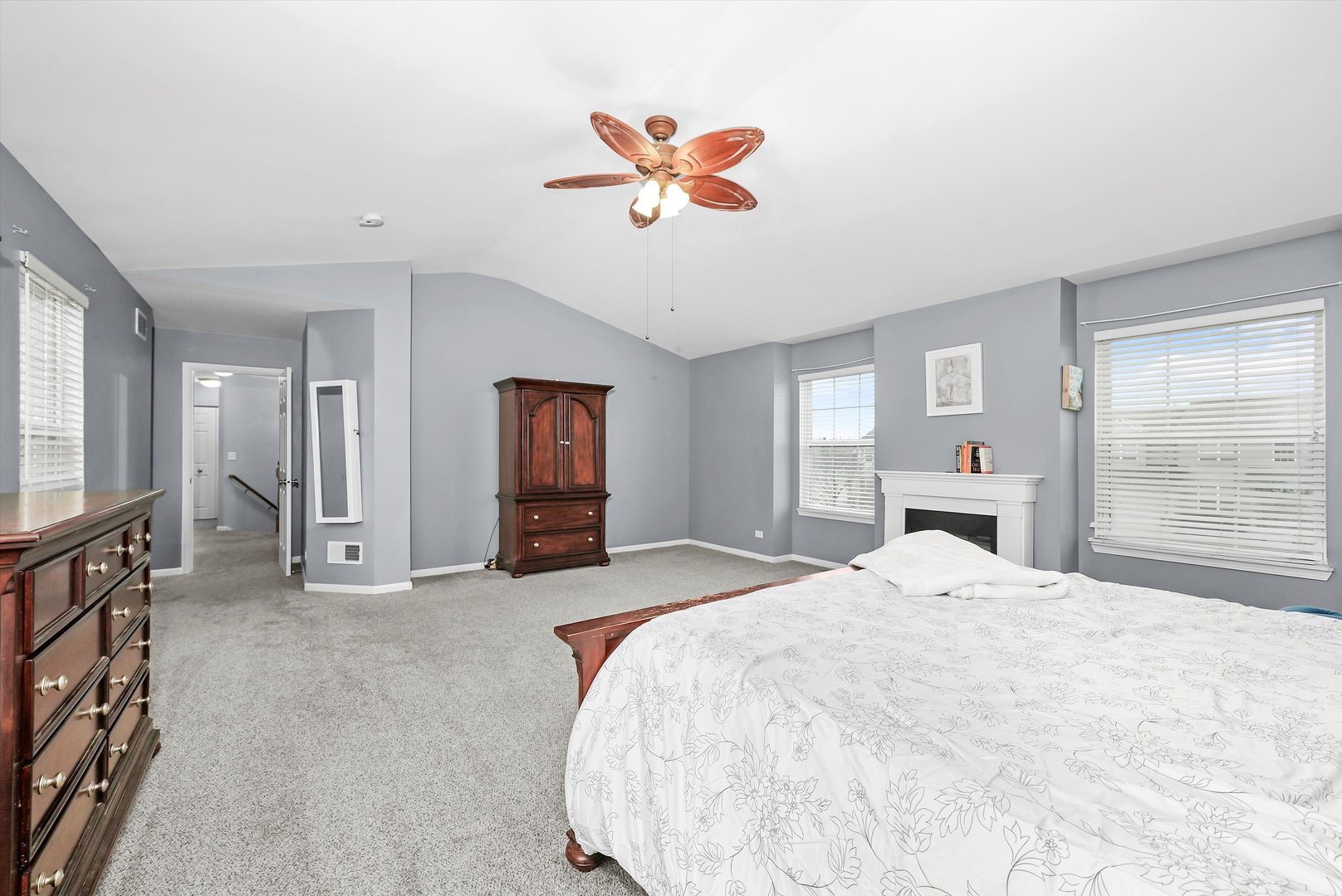 902 Farmstead Lane Shorewood, IL 60404 - Photo 19 of 35 a spacious bedroom with a bed and a large mirror