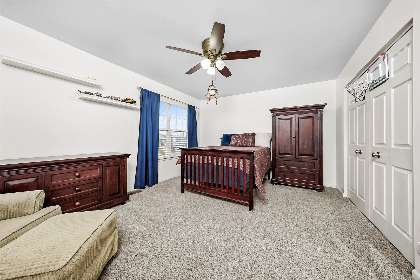 902 Farmstead Lane Shorewood, IL 60404 - Photo 21 of 35 a bedroom with a bed and a chandelier
