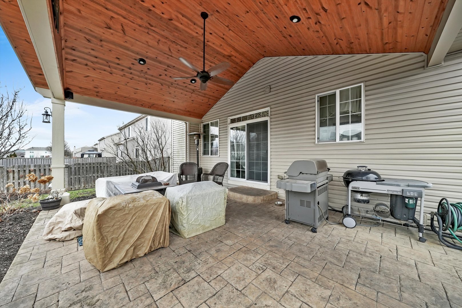 902 Farmstead Lane Shorewood, IL 60404 - Photo 26 of 35 a balcony with furniture and a ceiling fan