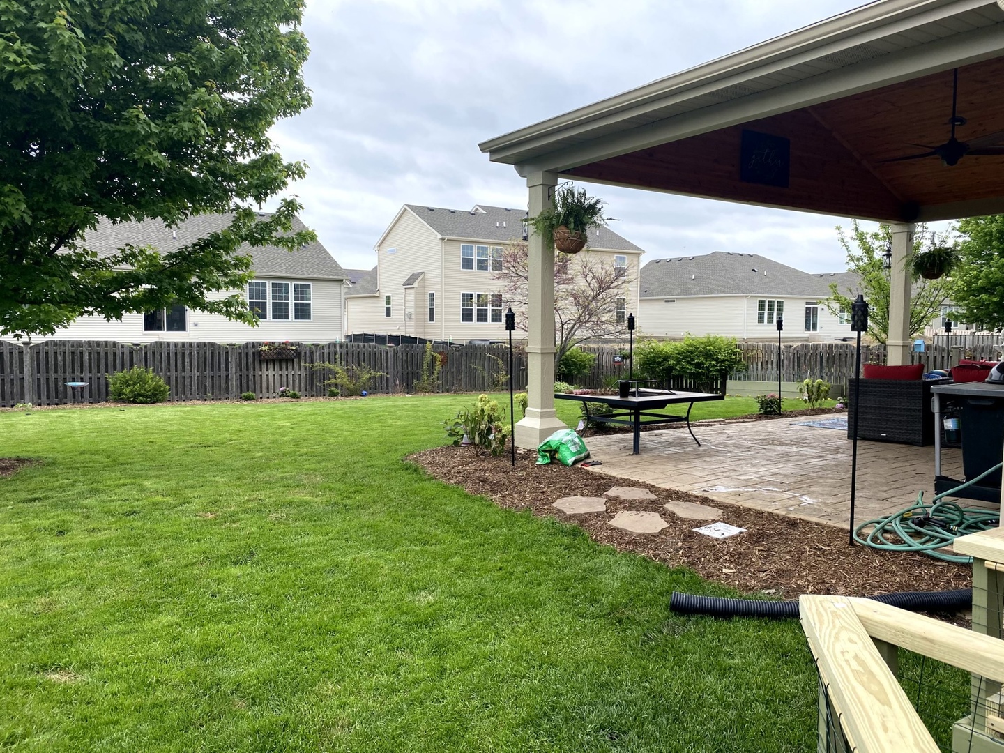 902 Farmstead Lane Shorewood, IL 60404 - Photo 28 of 35 a view of a house with backyard and a slide