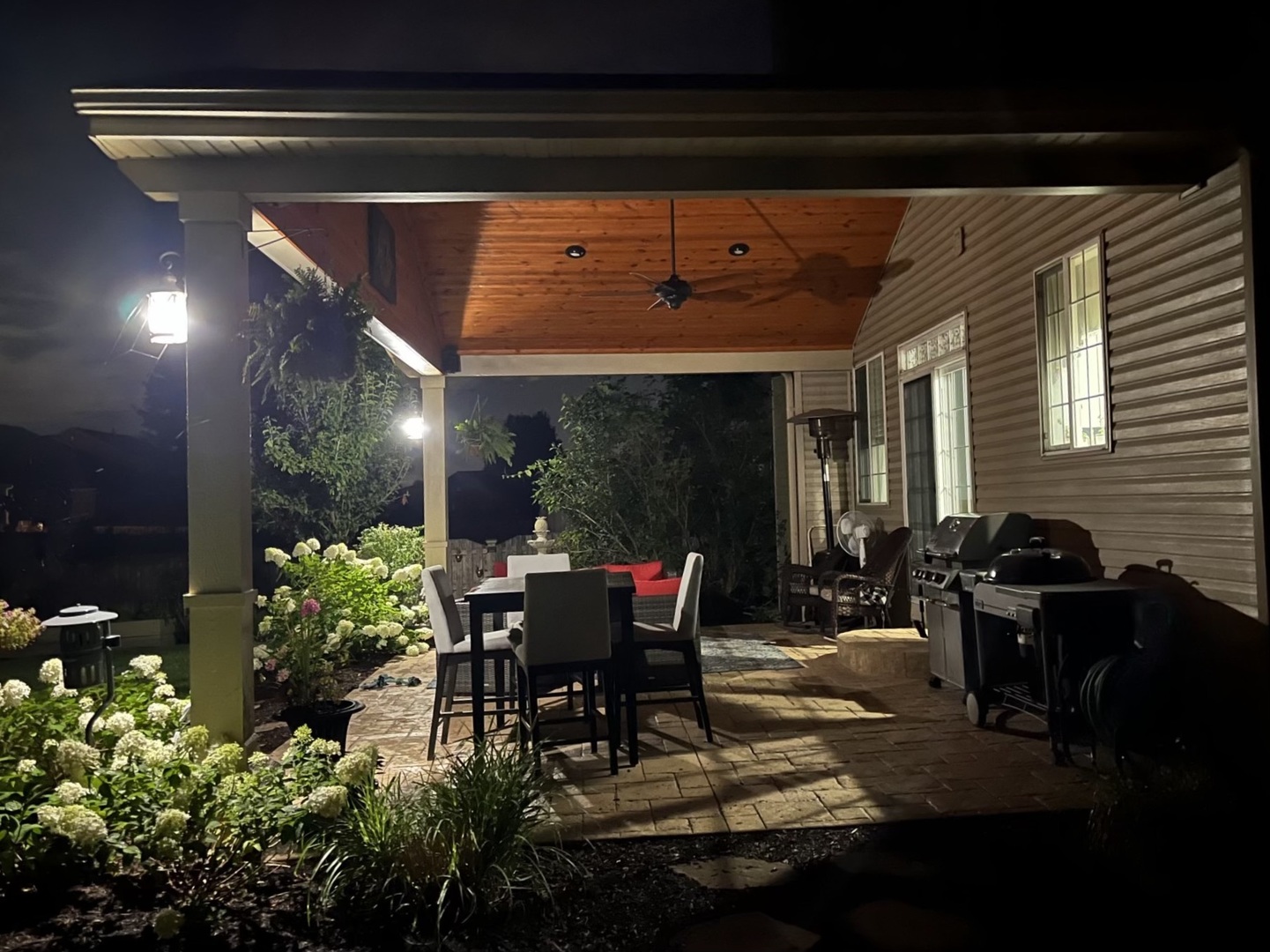 902 Farmstead Lane Shorewood, IL 60404 - Photo 29 of 35 a patio with table and chairs and potted plants