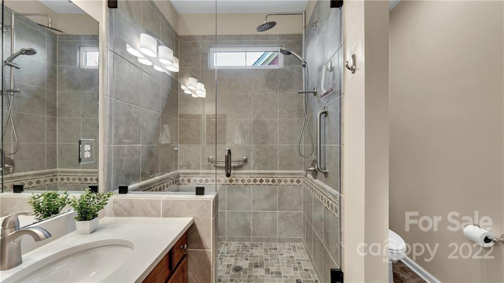 3221 Fifth Baxter Crossing Fort Mill, SC 29708 - Photo 21 of 30 a bathroom with a sink and a mirror