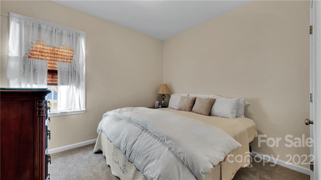 3221 Fifth Baxter Crossing Fort Mill, SC 29708 - Photo 23 of 30 a bedroom with a bed and a window