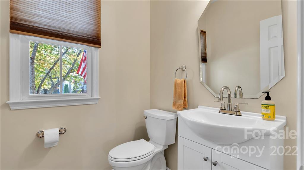 3221 Fifth Baxter Crossing Fort Mill, SC 29708 - Photo 7 of 30 a bathroom with a sink a toilet and a mirror