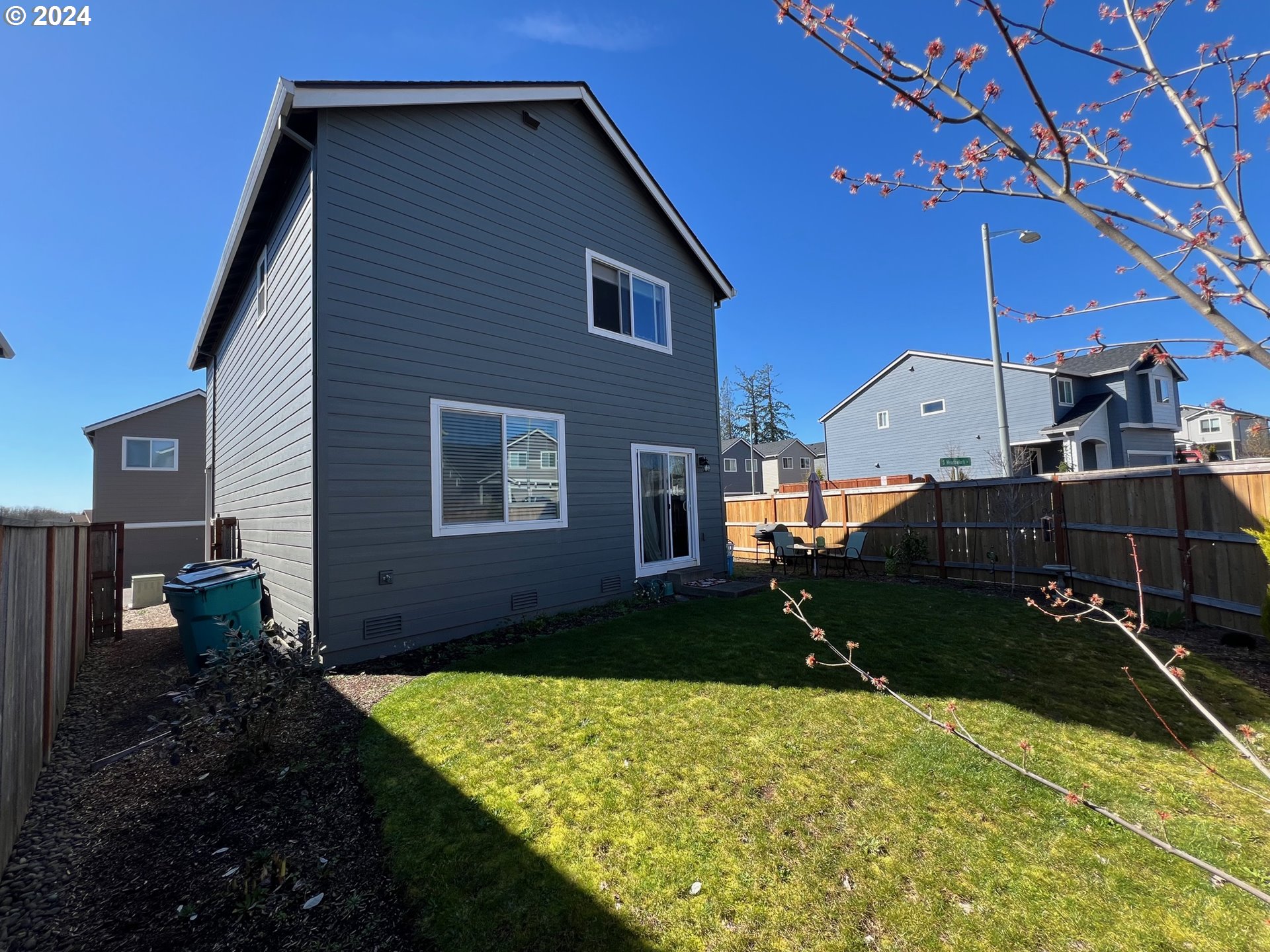 2044 South Chukar Drive Ridgefield, WA 98642 - Photo 15 of 16 a backyard of a house with lots of green space