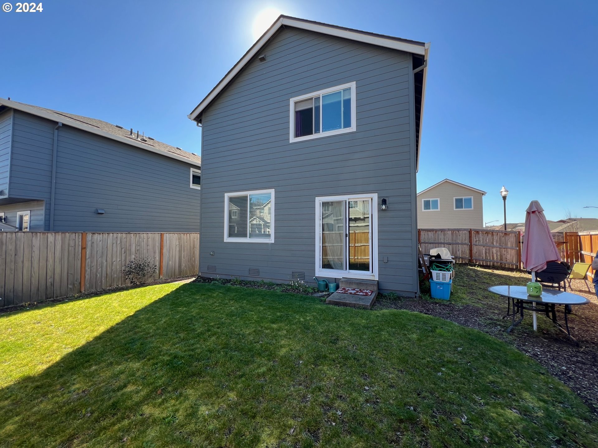 2044 South Chukar Drive Ridgefield, WA 98642 - Photo 16 of 16 a view of a house with a yard and sitting area