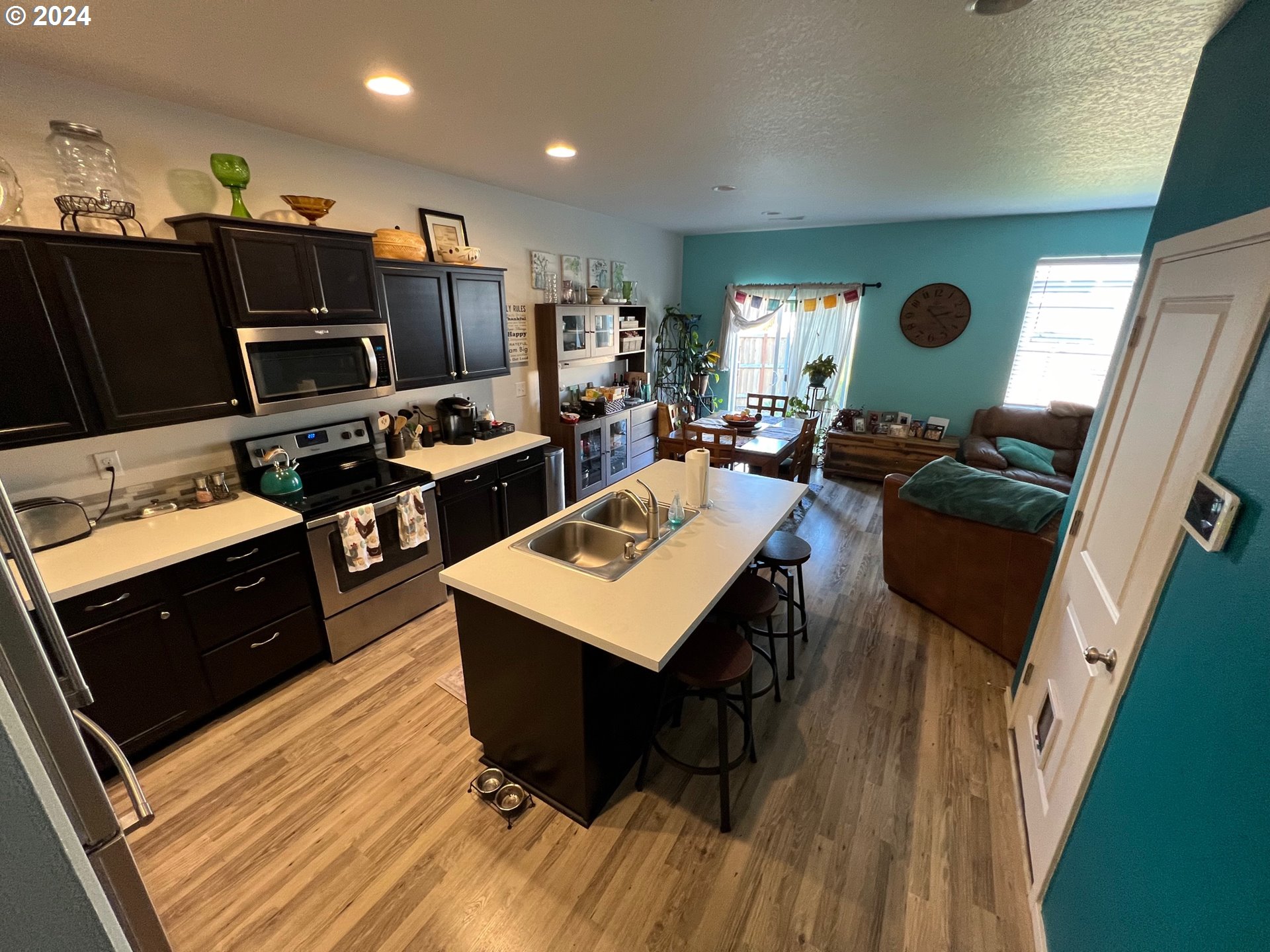 2044 South Chukar Drive Ridgefield, WA 98642 - Photo 2 of 16 a living room with furniture and a flat screen tv