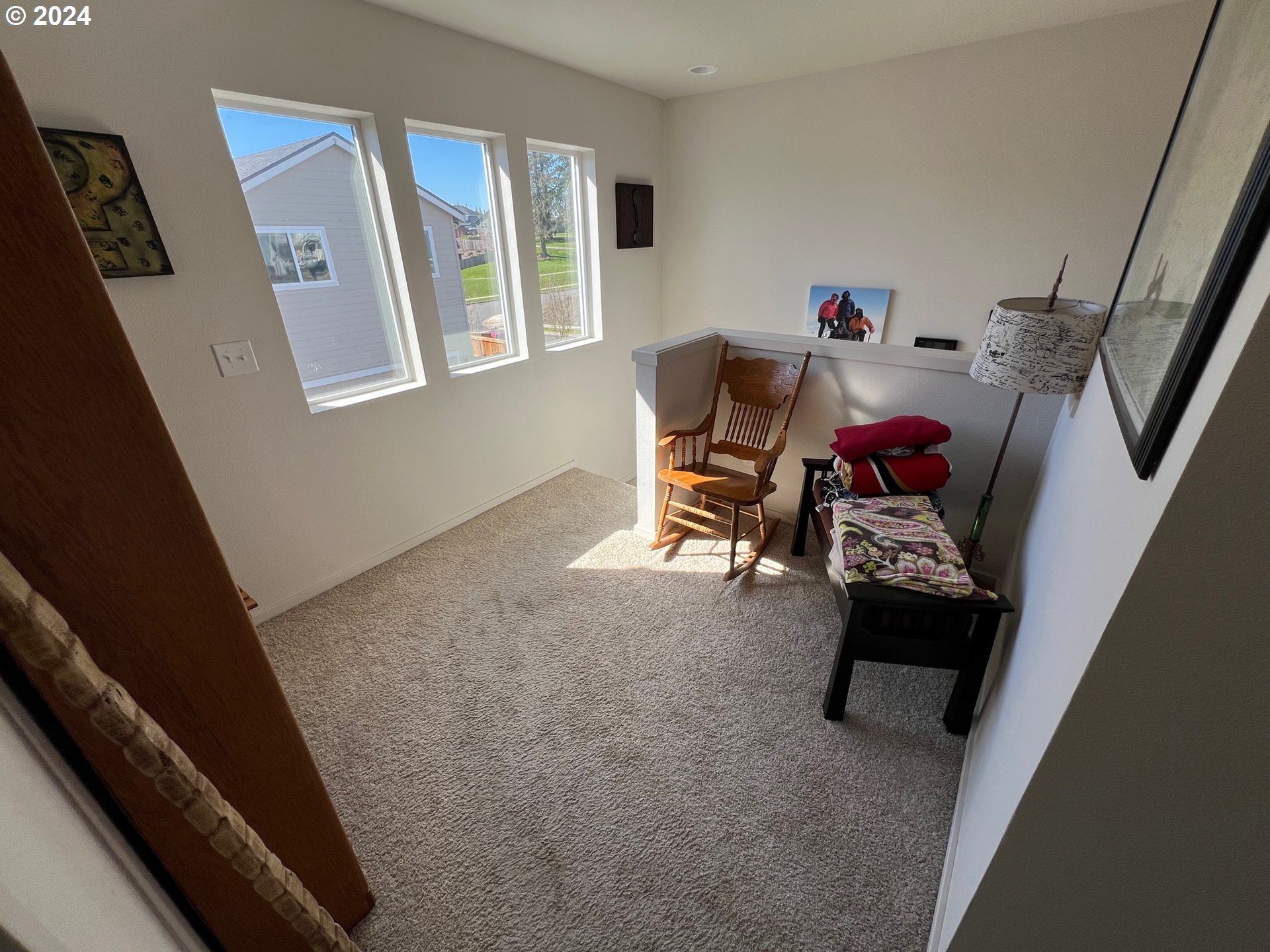 2044 South Chukar Drive Ridgefield, WA 98642 - Photo 6 of 16 a living room with furniture and a window