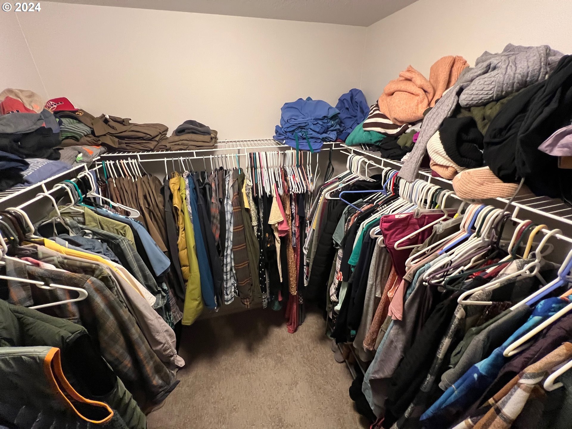 2044 South Chukar Drive Ridgefield, WA 98642 - Photo 8 of 16 a view of walk in closet with clothes