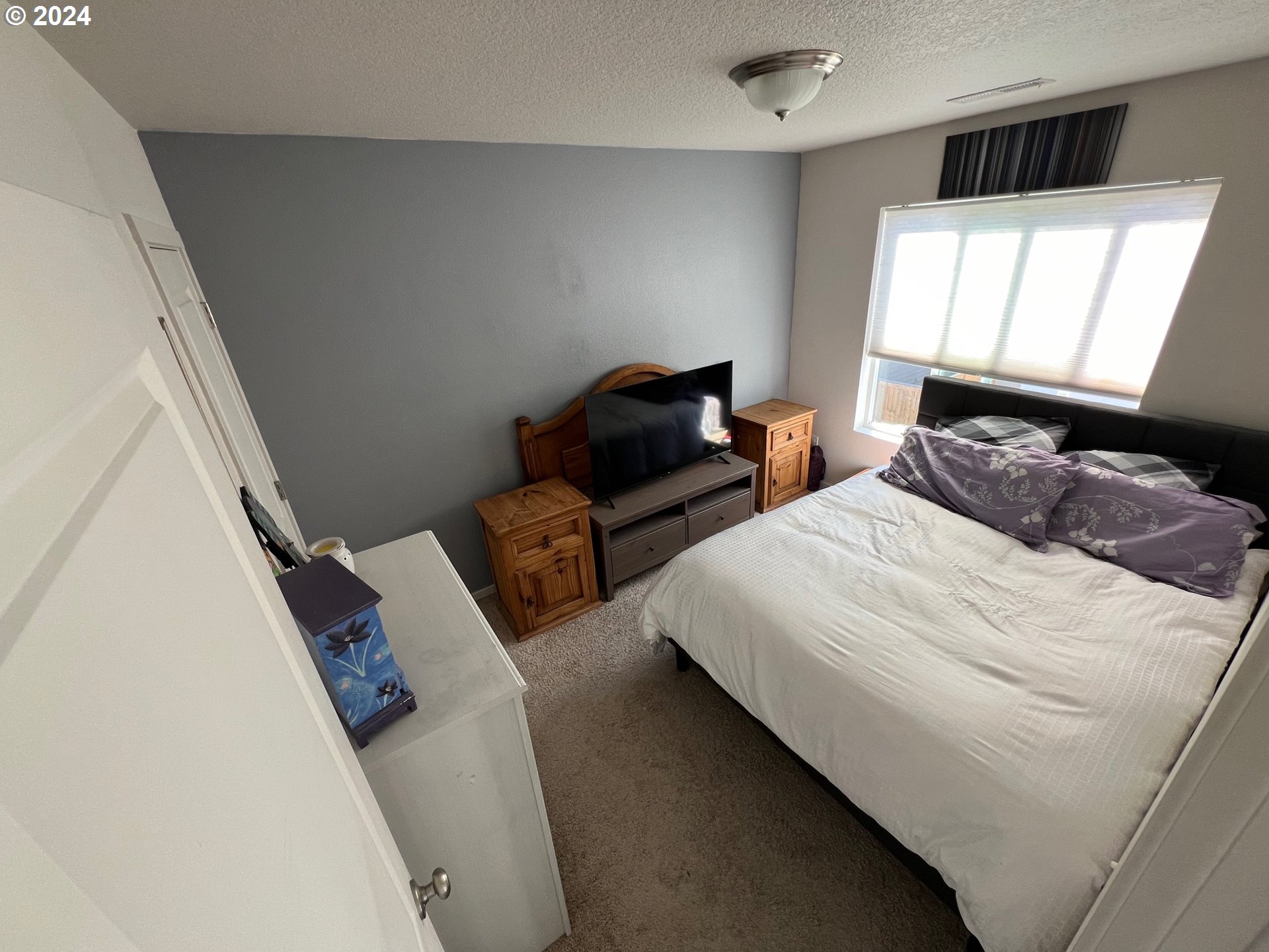 2044 South Chukar Drive Ridgefield, WA 98642 - Photo 10 of 16 a bedroom with two beds and a window