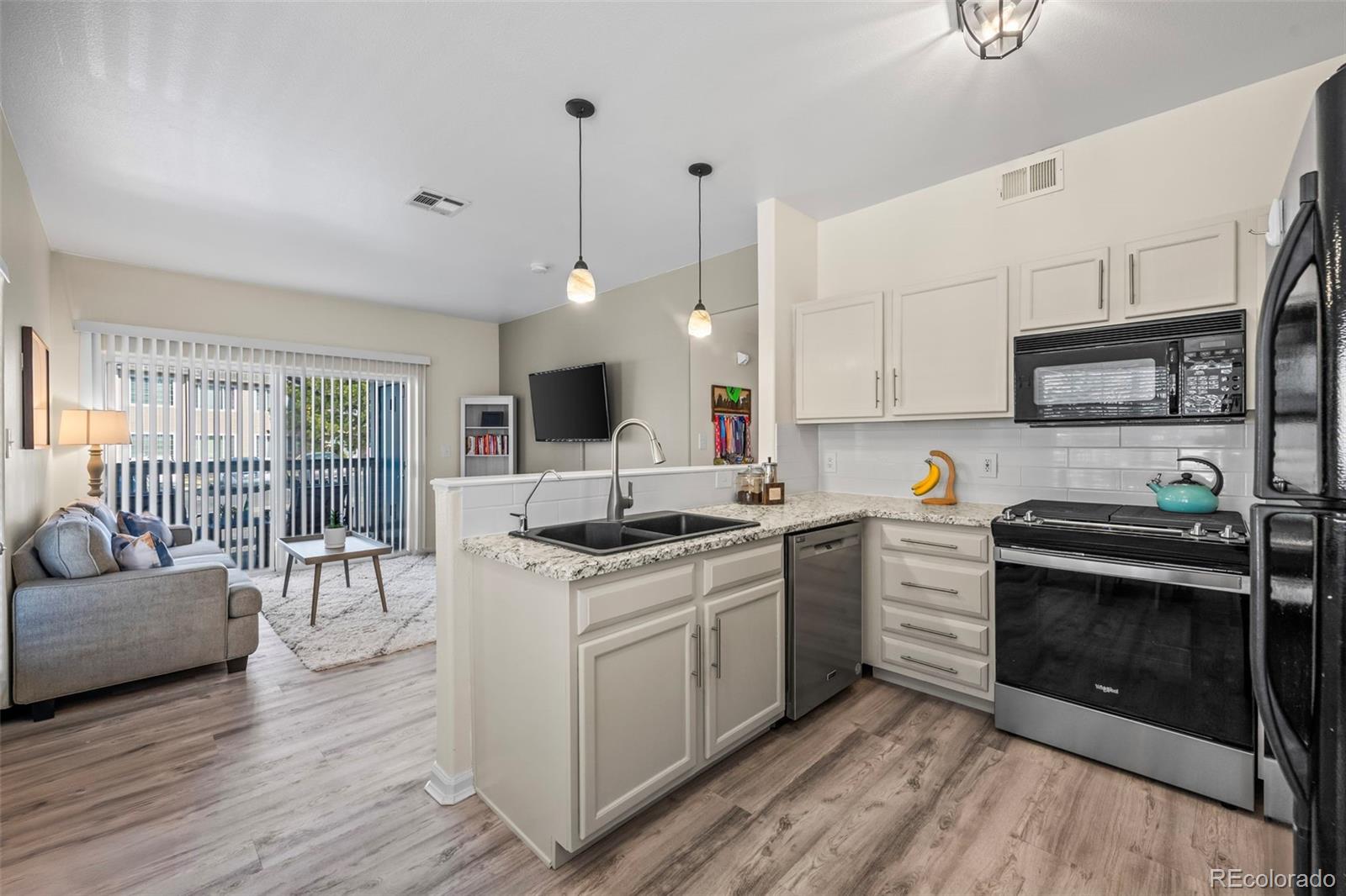 8435 Pebble Creek Way, Unit 104 Highlands Ranch, CO 80126 - Photo 1 of 19